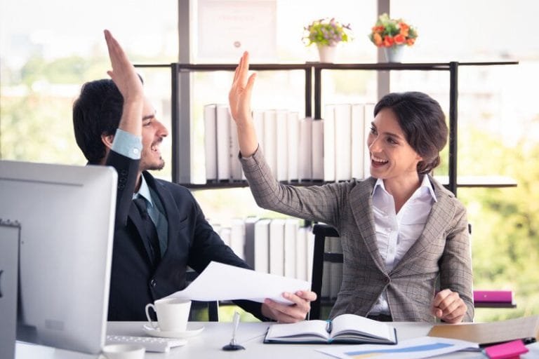Two colleagues planning event medical services cover ahead of CQC registration